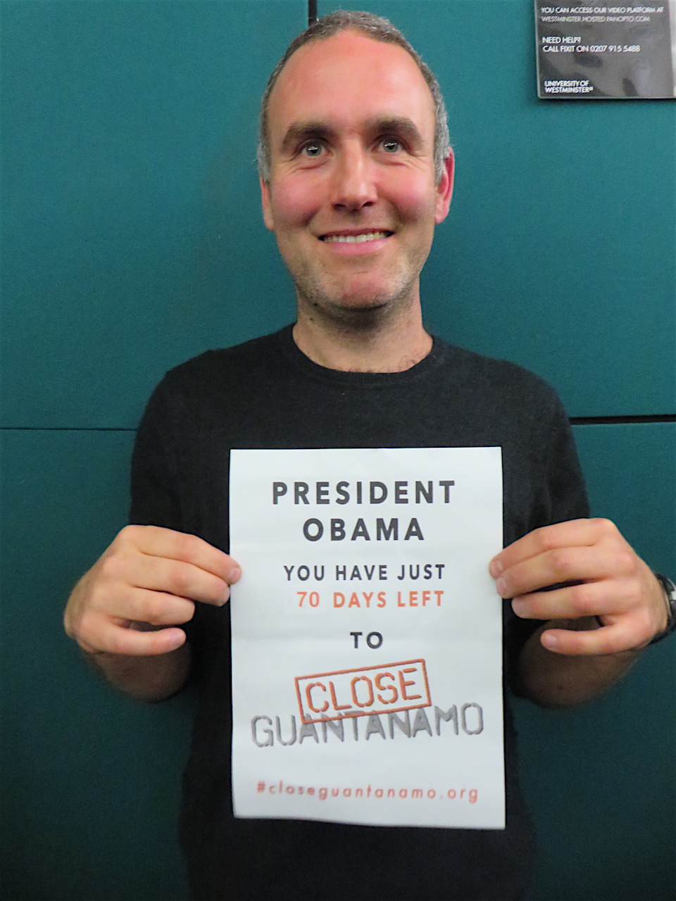 Sam Raphael of the University of Westminster reminding President Obama he had just 70 days left to close Guantanamo, on November 10, 2016 (Photo: Andy Worthington).