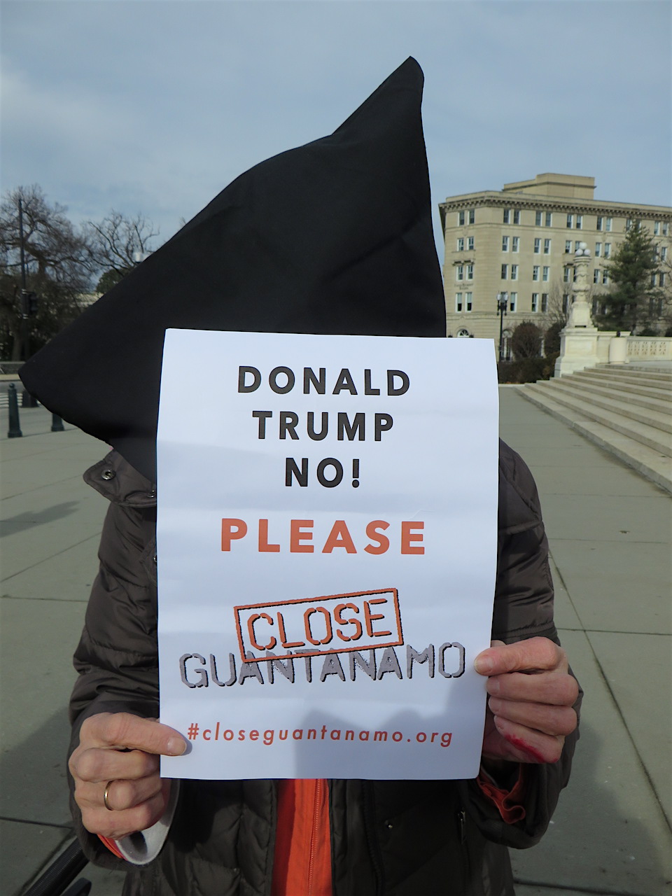 This hooded protestor, photographed in Washington, D.C. on January 11, the 15th anniversary of the opening of Guantánamo, is 85-year old peace campaigner Eve Tetaz, a former schoolteacher from Washington, D.C. and a Witness Against Torture activist who has been arrested on numerous occasions. This hooded protestor, photographed in Washington, D.C. on January 11, the 15th anniversary of the opening of Guantánamo, is 85-year old peace campaigner Eve Tetaz, a former schoolteacher from Washington, D.C. and a Witness Against Torture activist who has been arrested on numerous occasions.