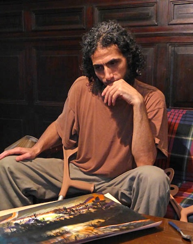 Abu Wa'el Dhiab photographed after his release in Uruguay with a picture he painted after his release (Photo: Oscar Bonilla).