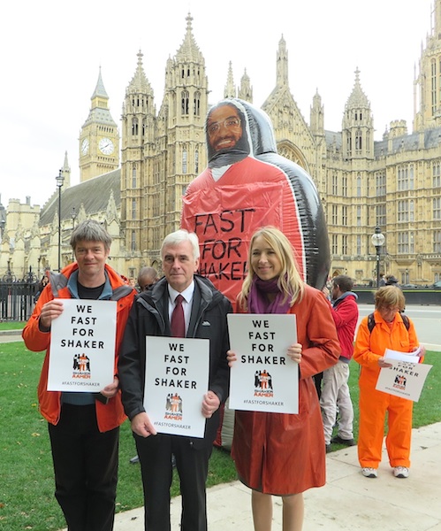 Andy Worthington, the Shadow Chancellor John McDonnell (the founder and co-chair of the All-Party Shaker Aamer Parliamentary Group) and Joanne MacInnes at the launch of Fast For Shaker outside Parliament on October 15, 2015 (Photo: Seb Corbyn for Andy Worthington).