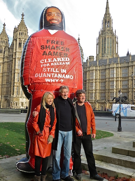 A previously unseen photo of Roger Waters (ex-Pink Floyd) with Andy Worthington and Joanne MacInnes of We Stand With Shaker, at the launch of the campaign outside the Houses of Parliament on November 24, 2014 (Photo: Dot Young).