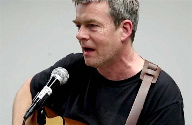 Andy Worthington singing 'Song for Shaker Aamer' in Washington, D.C. in January 2016 (Photo: Justin Norman).