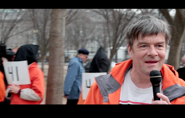 A screenshot of Andy Worthington calling for the closure of Guantanamo outside the White House on January 11, 2018.