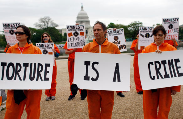 Anti-torture protestors outside the White House in May 2009, after President Obama's first 100 days in office.