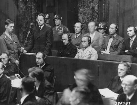 A photo from the Einsatzgruppen (mobile SS death squad) trial as part of the Nuremberg trials on September 15, 1947, at which Benjamin Ferencz, the last surviving Nuremberg prosecutor, was the chief prosecutor, at the age of 27. Standing is Otto Ohlendorf, the commander of one of the detah squads, delivering a plea of "not guilty." He was subsequently found guilty, and hanged.