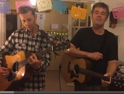 Richard Clare and Andy Worthington of The Four Fathers play '81 Million Dollars', Andy's song about the US torture program, in a screenshot from a video.