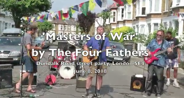 Screenshot from the video of The Four Fathers playing 'Masters of War' at a street party in June 2018.