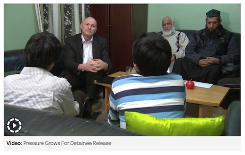 A screenshot of Ian Woods of Sky News interviewing two of Shaker Aamer's sons, Mikhail and Faris, in the presence of Saeed Siddique, Shaker's father-in-law, and Shaykh Suliman Ghani, the family's former imam.