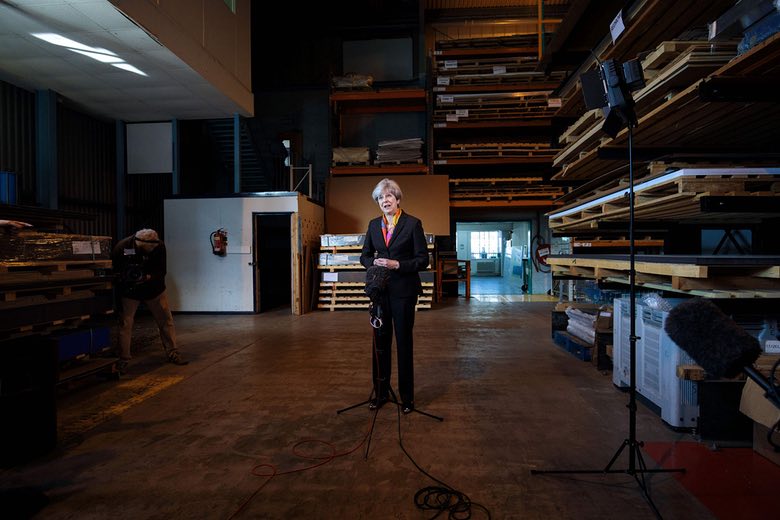 Despite the Tories doing well in the local elections on May 4, 2017, Theresa May remains a distant leader, unable to connect with ordinary people, as this photo of her making a statement at the end of a factory tour in Brentford shows.