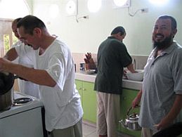 Four of the recently released Uighurs from Guantanamo in the kitchen of their new home in Koror, Palau, November 2, 2009 (Photo: AFP)